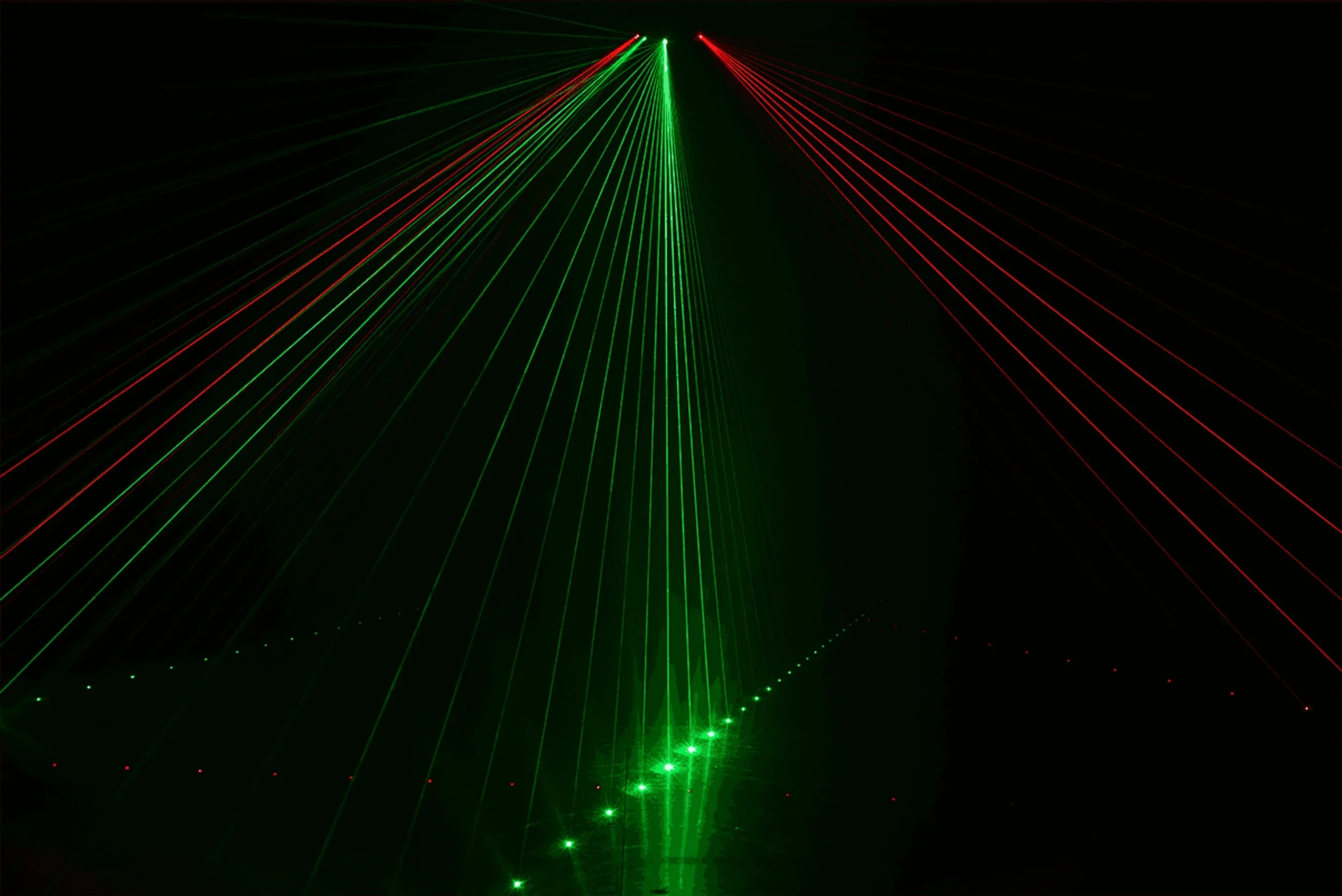 Algam Lighting 6-Beam 360mW RGB entertainment laser projecting dynamic multicolour beams in a nightclub, DJ set, or stage show environment
