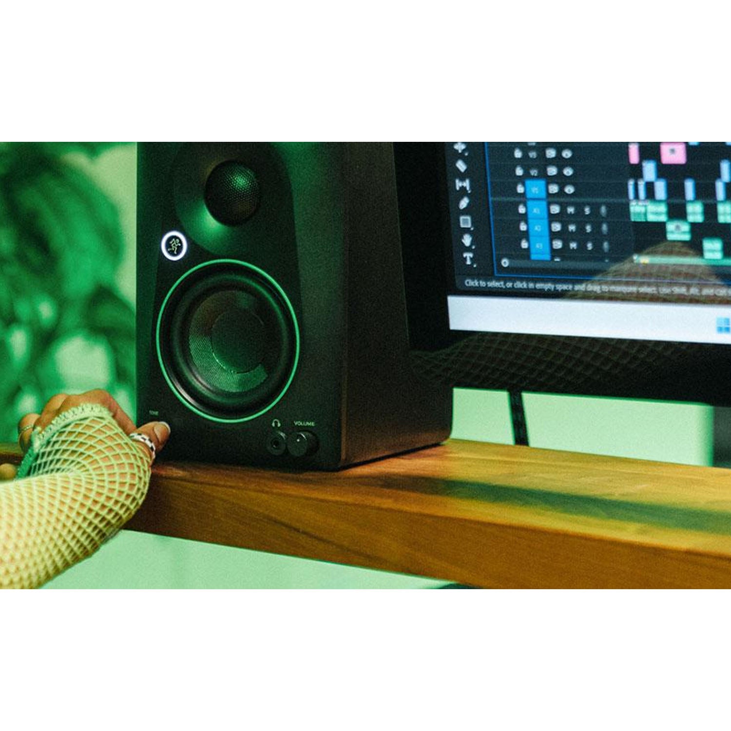Content creator using Mackie CR3.5 compact studio monitors for music production